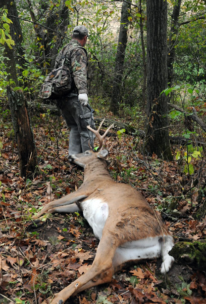 Hunter with Dead Buck
